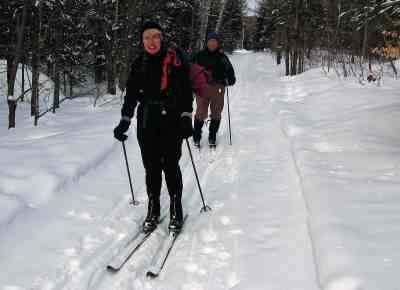 Photo by Herb Goodfriend 
Unlike Alpine, or downhill skiing, flat trails allow skiers to enjoy the outdoors at a leisurely pace. Above, cross-country skiers explore a park in Quebec during a ski club trip.