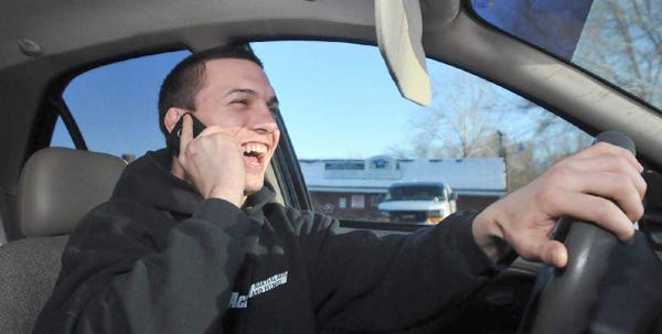 Matt Rizzi, 24, of East Stroudsburg does a little multitasking of driving and having a chat on the phone on Tuesday afternoon. Rizzi says even if a law is passed banning cell phone use while driving, he will most likely continue to do so.   To purchase a reprint of this photo, go to  www.PoconoRecord.com/photostore.