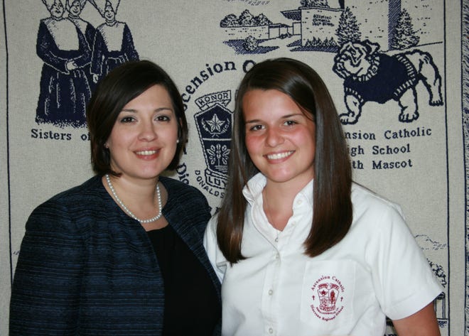 Ascension Catholic High School
Administrator/Principal, Sandy Pizzolato congratulates Macy Esneault on
her selection to The National Society of High School Scholars. NSHSS
recognizes academic excellence at the high school level.