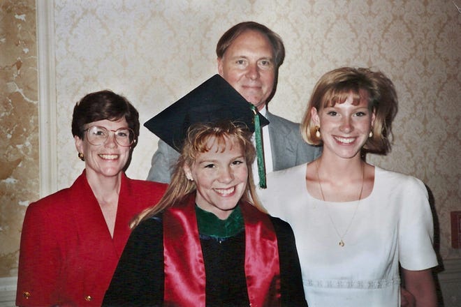 Dr. Kerry Spooner-Dean stands following her 1993 graduation from the University of Illinois College of Medicine at Peoria with her sister, Erin Mayes, right, and her parents Mary and Herb Spooner. Spooner-Dean was murdered five years later and her family endowed a scholarship at the medical school in her name. Almost every May since then, Mary and Herb Spooner attend the awards ceremony and gain some solace with the feeling their daughter's work carries on through the award recipients.