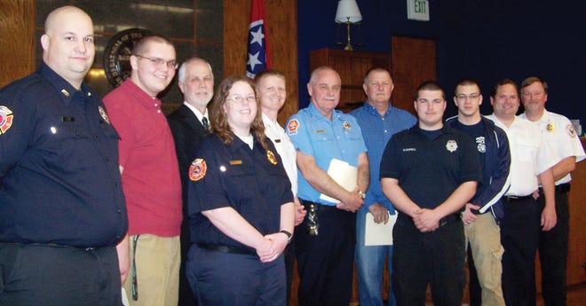 The Anderson County Commission honored nine local first responders for their service to citizens. Back row from left, are Chris Zorn, Marlow Volunteer Fire Department; Joshua Lane, Lake City Fire Department; County Mayor Myron Iwanski; Emergency Medical Service Director Nathan Sweet; Joe Gilliam, Lake City Fire Department; Dusty Carroll, Clinton Parks and Recreation employee; Daniel Miller, Andersonville Volunteer Fire Department; EMS Assistant Chief Darrell Muse; front row from left, Stephanie Fox, Marlow VFD; Matt Burrell, Andersonville, VFD; and Caleb Tuell, Andersonville VFD.