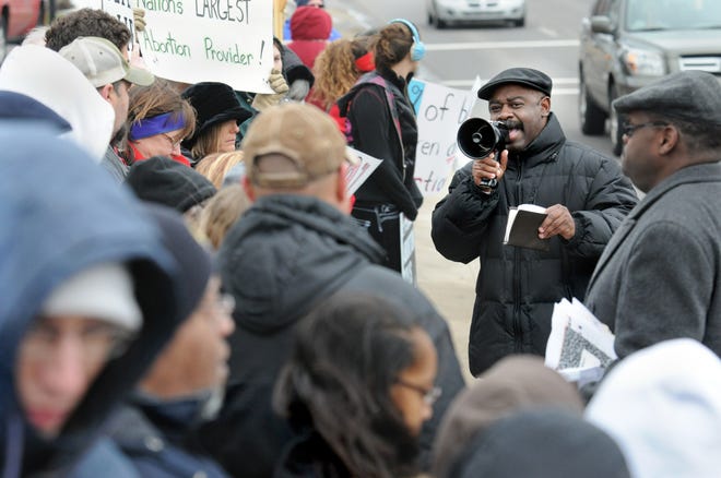 Reverend MIchael Pressley speaks during the "National Day of Mourning" organized nationwide by the National Black Prolife Coalition during Black History month. The demonstration outside Planned Parenthood on Cleveland AVe NW was to bring to light the disproportionate number of abortions performed in the Black population.