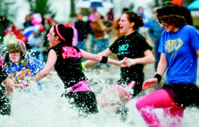 Women are shocked by the ice cold water during Sunday's Polar Plunge.