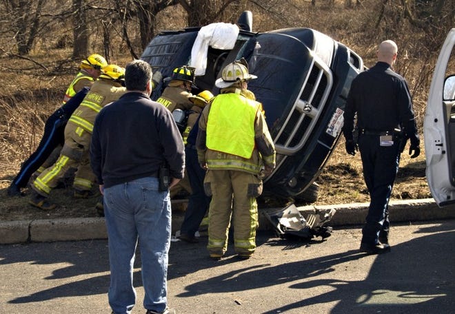 Emergency personnel flip the vehicle on it's side back over. Two vehicle crash at US 1 off ramp at Maple Road in Langhorne Wednesday afternoon. 

David Garrett/Staff Photographer