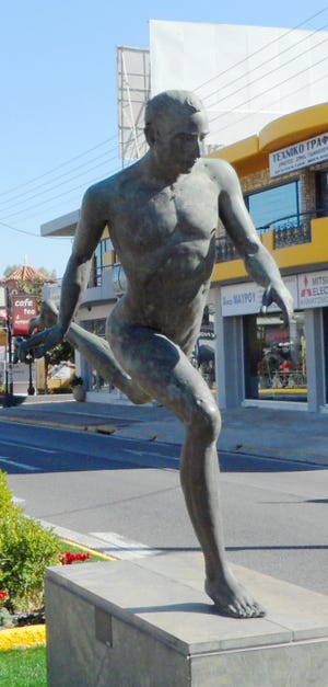 This modern representation pays tribute to Pheidippides, the Athenian courier who ran 175 miles in a three-day period before dropping dead from exhaustion.