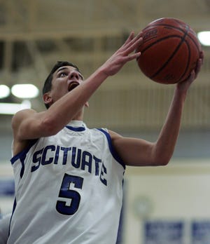Scituate's Luke Thunberg takes it to the basket for two points after his pressure defense caused the steal in a Div. 2 South boys basketball tournament game Tuesday, March 1.