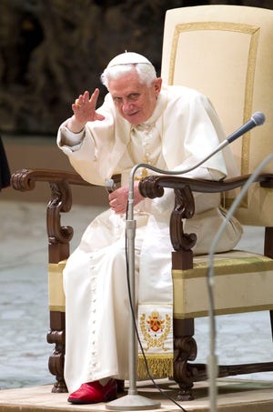 Pope Benedict XVI delivers his blessing during a general audience in the Pope Paul VI hall at the Vatican, Wednesday, March 2, 2011. (AP Photo/Andrew Medichini)