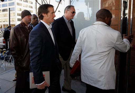Pittsburgh Steelers quarterback Charlie Batch, left, New Orleans Saints quarterback Drew Brees, second from left, Jim McFarland, second from right, a member of the NFL Players Association's executive committee, and DeMaurice Smith, NFLPA executive director, arrive for football labor negotiations with the NFL involving a federal mediator in Washington Thursday, March 3, 2011. The NFL and the players' union sat down Thursday morning for a last-ditch effort to avoid a work stoppage in America's most popular sport.(AP Photo/Alex Brandon)