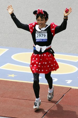 Costumed runners are part of the Boston Marathon.