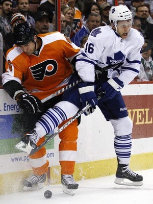 Philadelphia Flyers' Sean O'Donnell (6) and Toronto Maple Leafs' Joey Crabb (46) collide in the first period of an NHL hockey game on Thursday, March 3, 2011, in Philadelphia. (AP Photo/Matt Slocum)