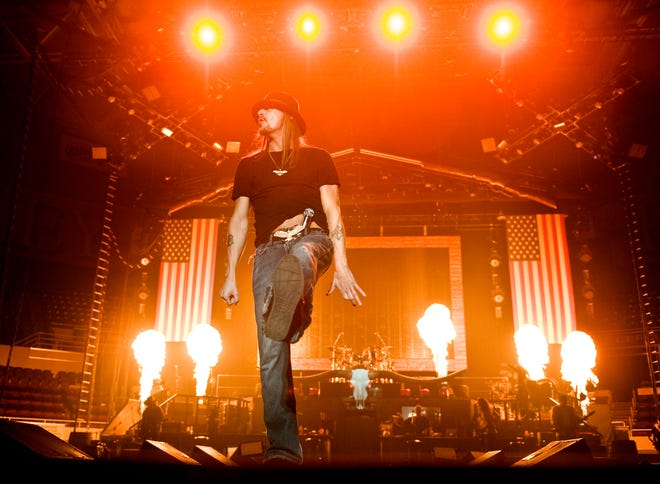 Kid Rock lights up the Peoria Civic Center Arena Monday night with pyrotechnics and his mix of rap, country and rock during his "Born Free" Tour.