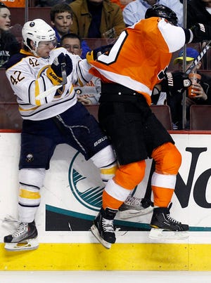 Buffalo Sabres' Nathan Gerbe, left, and Philadelphia Flyers' Kris Versteeg collide in the second period of an NHL hockey game, Saturday, March 5, 2011, in Philadelphia. (AP Photo/Matt Slocum)