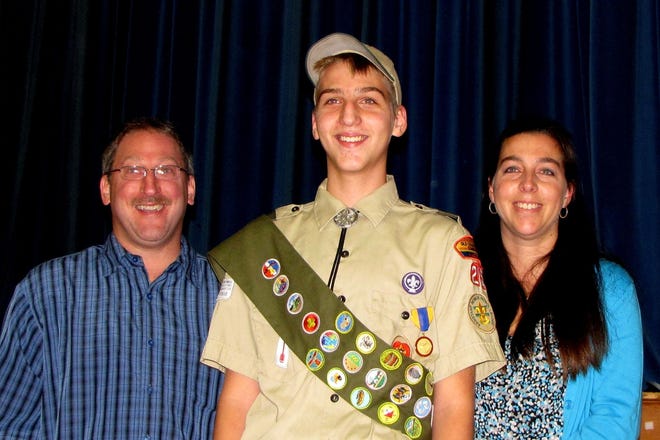 Luke Smith, 15, of West Bridgewater was awarded the national Medal of Merit for extraordinary achievement in Boy Scouts. With him are his parents Wade and Stephanie Smith.