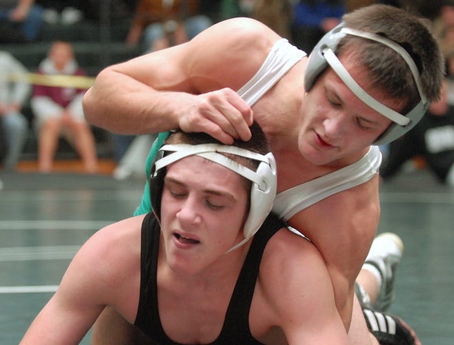 Griswold's Brandon Walsh, top, pushes Old Saybrook/Westbrook's Mike Avena to the mat the 135-pound championship match at the Griswold Invite wrestling tournament at Griswold High School Saturday, January 15, 2011. Walsh won, 9-2.