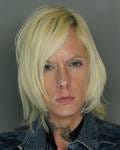 She is one of four suspects accused of robbing dates through an online dating site.