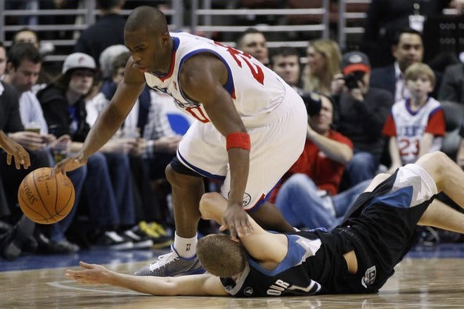 The Sixers' Jodie Meeks collides with the Timberwolves' Luke Ridnour during Friday's game at the Wells Fargo Center. (AP Photo/Matt Slocum)