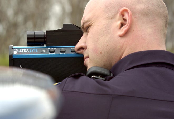 City of Canton police officer Eric Brown runs radar during traffic enforcement along I-77 South.