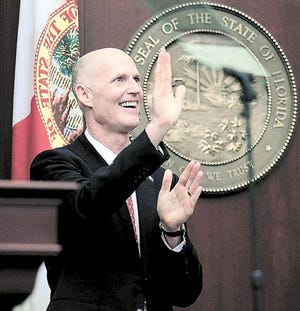 Florida Gov. Rick Scott waves to the gallery before delivering his state of the state speech to the Florida legislature in Tallahassee, Fla., Tuesday, March 8, 2011. (AP Photo/Chris O'Meara)