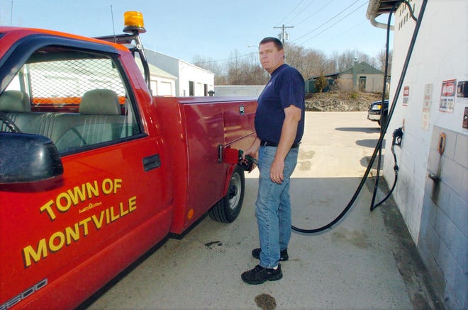 Lyle Flaherty, a town maintenance worker at Montville Public Works, pumps gas Tuesday into a mechanic's truck at the on grounds pumping station.