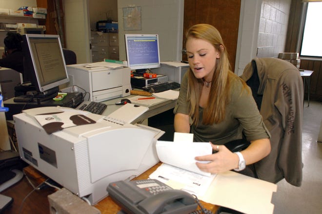 Intern Ashley Langlois works in the records room at the Brockton Police Department on March 9, 2011.