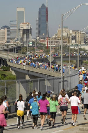 Runners wind their way down the Hart Bridge and toward the finish line of the 34th annual Gate River Run on Saturday.