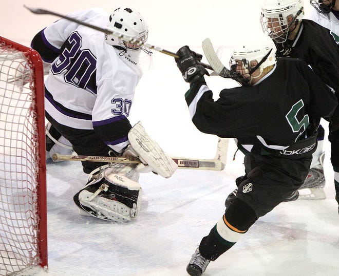 Gallo Arena, Bourne: Marshfield vs Springfield Cathedral. Marshfield forward Jimmy Connors squeezes the puck past the Cathedral goalie and into the net for the Rams second goal.