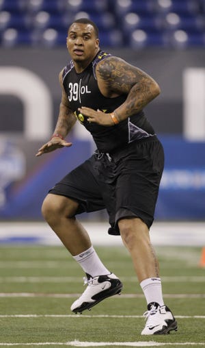 Florida Gators offensive lineman Mike Pouncey runs a drill during the NFL Scouting Combine on Saturday, Feb. 26, in Indianapolis.
