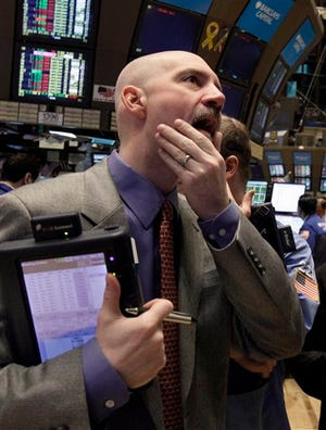 Trader Patrick Armstrong works on the floor of the New York Stock Exchange Tuesday, March 15, 2011.