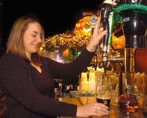 Bartender Megan Stuhlfauth draws a glass of Guinness on Monday at Dunleavy's Restaurant and Cocktail Lounge in Hainesport.