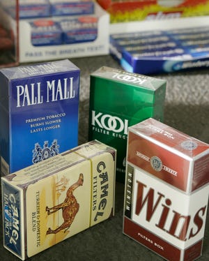 In this Oct. 24, 2006 file photo, cigarette products of the R.J. Reynolds Tobacco Company, part of Reynolds American, are shown on the counter of a beverage store in Creamery, Pa. Reynolds American Inc., the nation's second-biggest tobacco maker, says its second-quarter profit rose 12 percent, Wednesday, July 30, 2008, as it raised prices for cigarettes to offset volume declines.