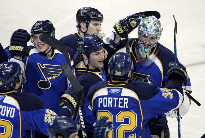 St. Louis Blues goalie Ben Bishop, right, is congratulated by his teammates after finishing off the Columbus Blue Jackets in the shootout of an NHL hockey game, Monday, March 7, 2011 in St. Louis. The Blues won 5-4. (AP Photo/Tom Gannam)