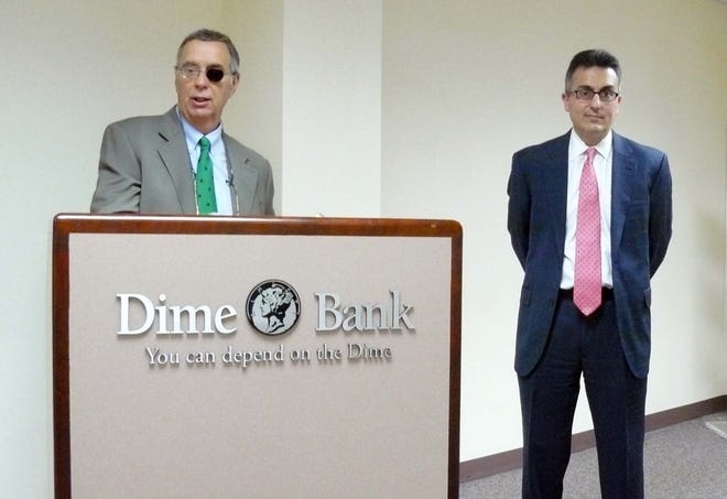 Dime Bank President James Cronin, left, announces his retirement Thursday after 24 years heading the bank. Chief Financial Officer Nick Caplanson, right, was named the new president as of October 1 , 2011.