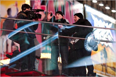 In Times Square, from left, Matthew Cady, a cameraman, with Michael Krivicka and James Percelay of Thinkmodo.