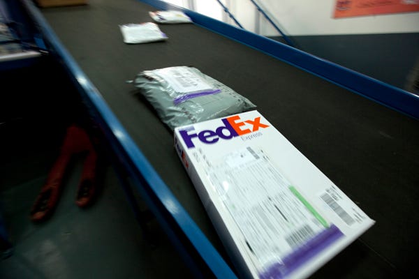 Parcels move down the line at a FedEx Corp. station in Shanghai, China, on Tuesday, Jan. 11, 2011. FedEx's Asia-Pacific hub is in Guangzhou. The company is the subject of a civil investigation by the U.S. Justice Department.