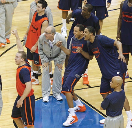 Syracuse head coach Jim Boeheim, center, and players watch a 3-point shot during practice in the second round of the East Regional NCAA college basketball tournament Thursday in Cleveland. Syracuse will play Indiana State Friday.