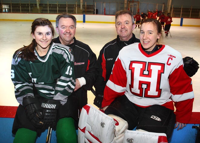 Preparing for state high school girls hockey championship games are, from left, Duxbury player Martha Findley; her dad, Hingham assistant coach John Findley; his twin brother, Tom Findley, Hingham’s head coach; and Tom’s daughter, Beth, the goalie for Hingham.