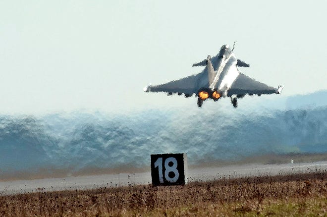 This photo provided by the French Army shows a French Air Force Rafale jet fighter taking off for a mission over Libya at the military base of Saint Dizier, eastern France, Sunday, March 20, 2011.Top officials from the United States, Europe and the Arab world have launched immediate military action to protect civilians as Libyan leader Moammar Gadhafi's forces attacked the heart of the country's rebel uprising. (AP Photo/ Sebastien Dupont)