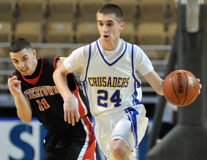 Whitinsville Christian sophomore point guard Colin Richey drives past Watertown’s Meroujan Bagdasarian.