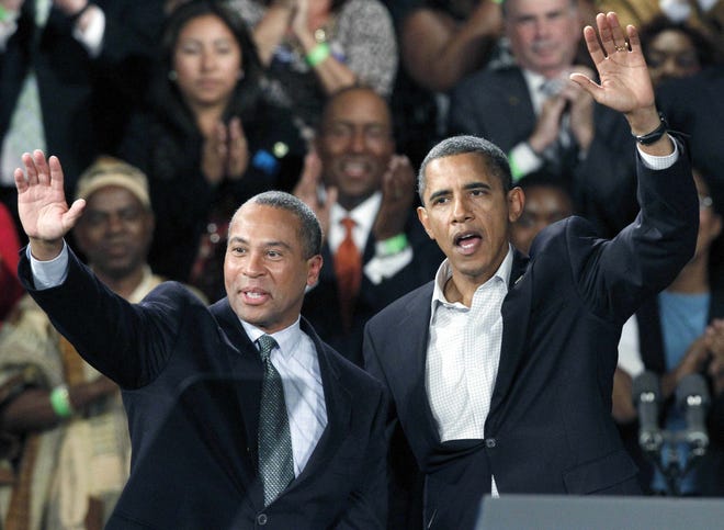 President Barack Obama and Massachusetts Gov. Deval Patrick wave to the crowd during a campaign rally for Patrick at the Hynes Convention Center in Boston, Saturday, Oct. 16, 2010. (AP Photo/Michael Dwyer)