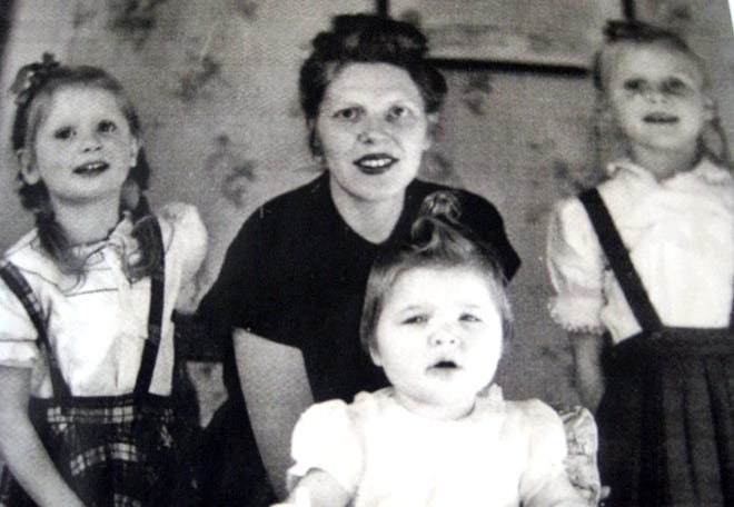 Dr. Wilhelmina Van Dyke Lord in her Milton home circa 1950, in the room she used as an office, with her three oldest children, from left, Susan, Margaret and Diana.