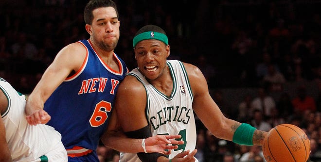 Boston's Paul Pierce drives past New York's Landry Fields during the second half of Monday night's game. Pierce finished with 21 points as the Celtics rallied from a 14-point halftime deficit to beat the Knicks, 96-86.