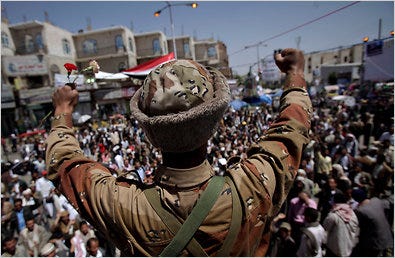 A Yemeni Army officer cheered protesters in Sana on Monday. More than a dozen senior commanders have joined the opposition.