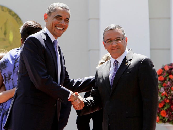 President Barack Obama, left, shakes hands with El Salvador's President Mauricio Funes during a welcoming ceremony in San Salvador, El Salvador, on Tuesday March 22, 2011. (The Associated Press)