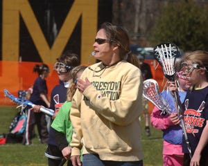 Mary Stefano coaches the Moorestown Elementary School girls lacrosse team at practice Sunday at Wesley Bishop Park in Moorestown. Stefano is a Moorestown High School graduate and played lacrosse at Penn State.