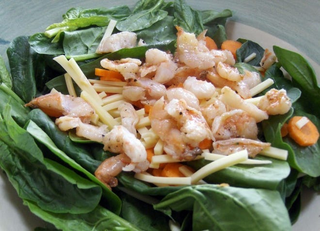 Wilted Spinach Salad with Shrimp, Avocado and Olives.