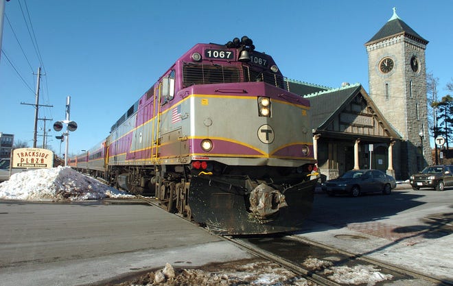 A southbound train stops at the Stoughton station.