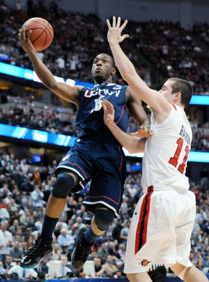 Connecticut's Kemba Walker drives past San Diego State's James Rahon on Thursday night in Anaheim, Calif. Walker scored 22 of his 36 points in the second half for the Huskies.