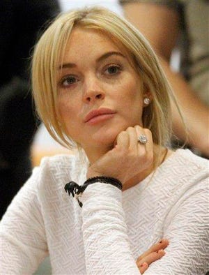 In this Feb. 9, 2011 file photo, actress Lindsay Lohan appears in court during her arraignment on a felony grand theft charge at the LAX Airport Courthouse in Los Angeles.