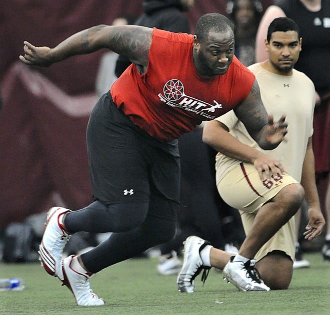 Former Wellesley High School star Thomas Claiborne does an agility drill as one of 39 NFL hopefuls at Boston College's pro day in Chestnut Hill yesterday.