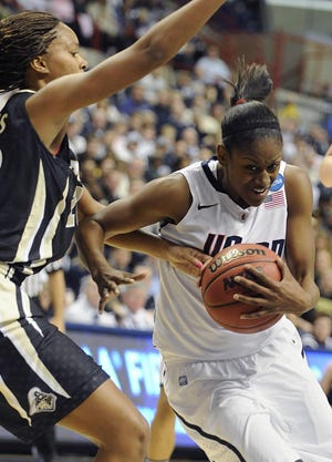 Connecticut's Tiffany Hayes, right is guarded by Purdue's Dee Dee Williams during the second half of a second-round NCAA women's college tournament basketball game in Storrs, Conn., Tuesday, March 22, 2011. Connecticut won 64-40. Hayes scored 23 points.